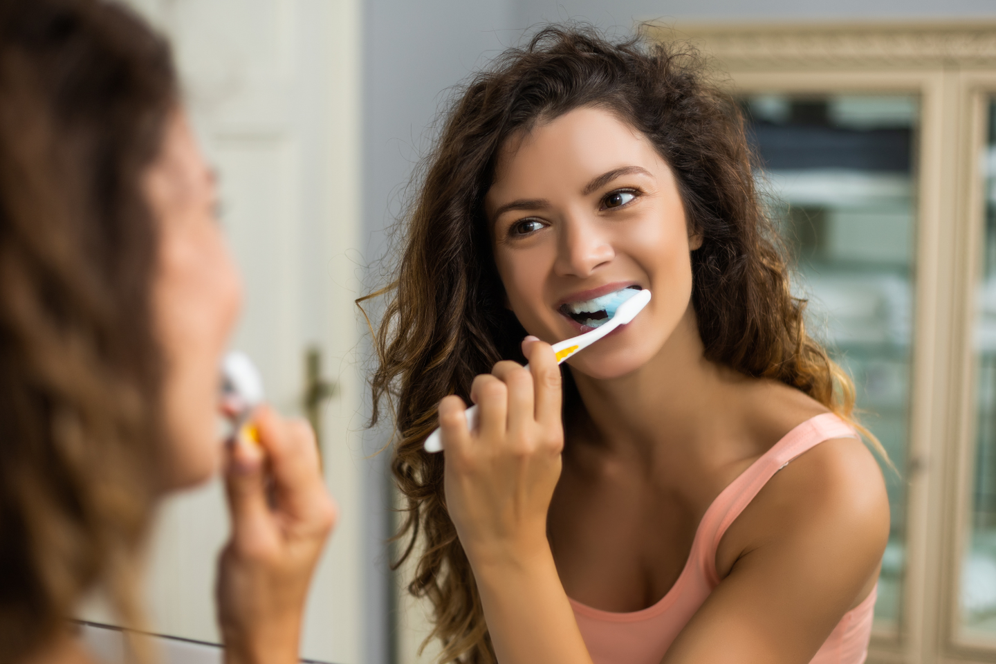 Toothbrush icon with a caution symbol highlighting brushing mistakes
