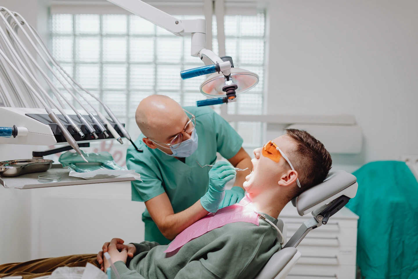 Dentist performing routine dental checkup—emphasizing preventive care and six-month visit guidelines.