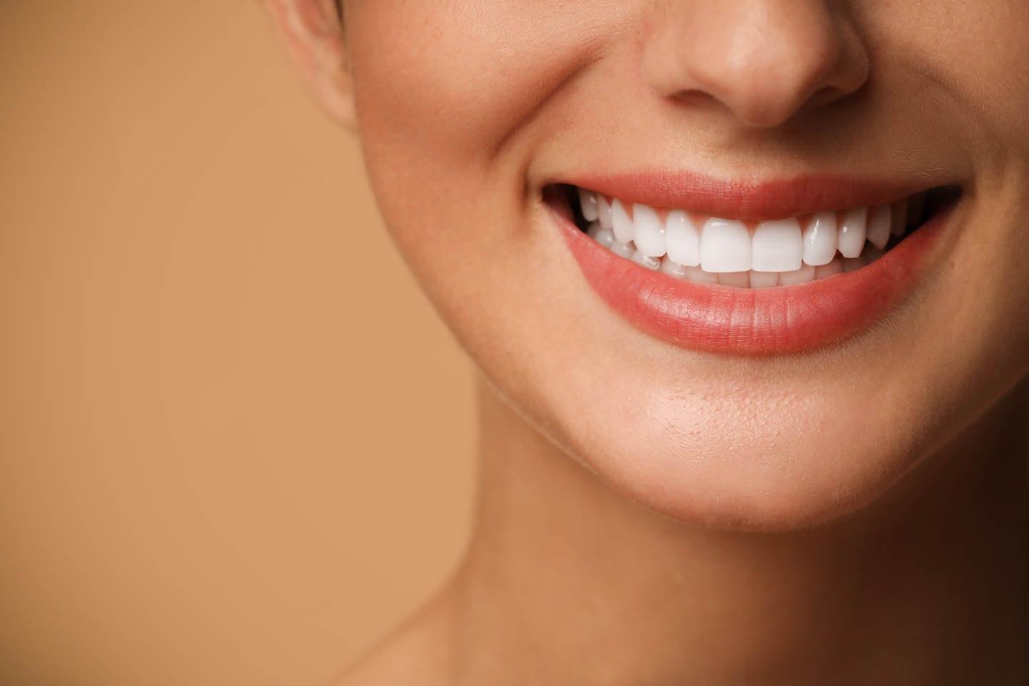 Smiling patient after cosmetic dental makeover at Varni Dental in San Jose.