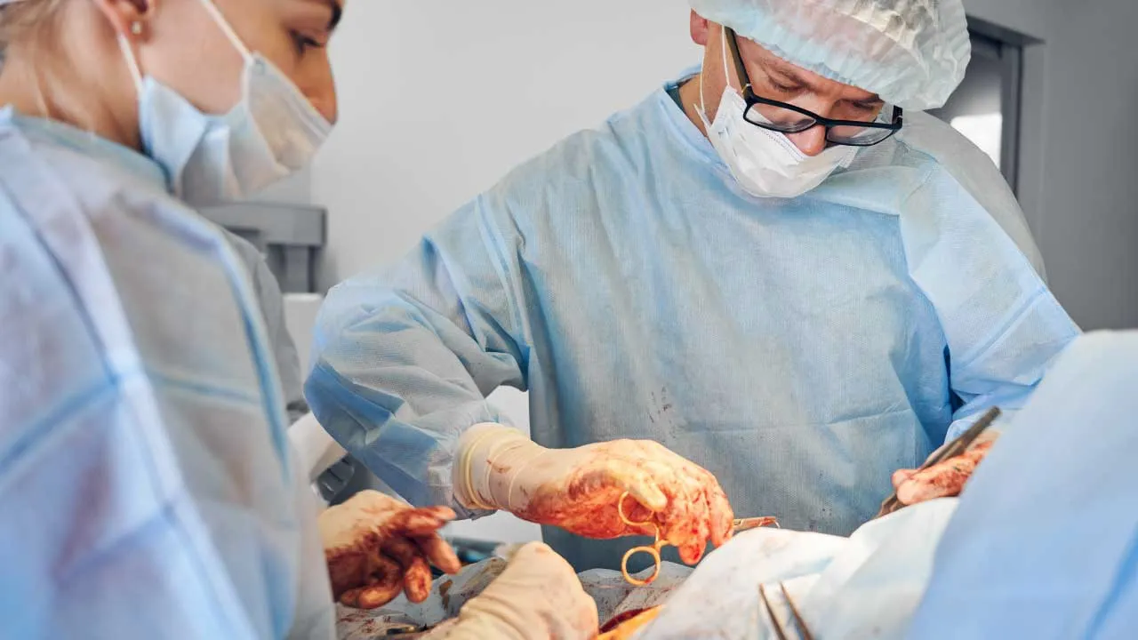 Gynecologist explaining ovarian drilling procedure for PCOS-related infertility to a patient