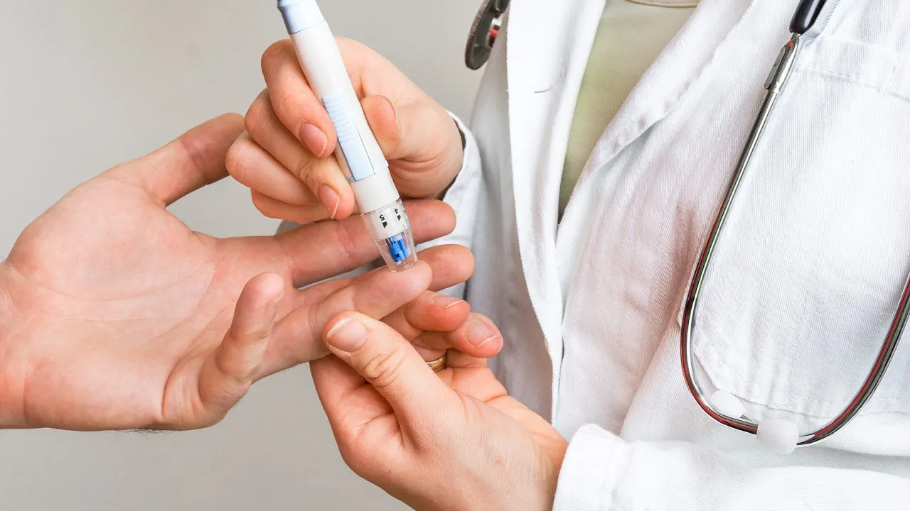 Doctor explaining the effects of uncontrolled diabetes on various organs of the body
