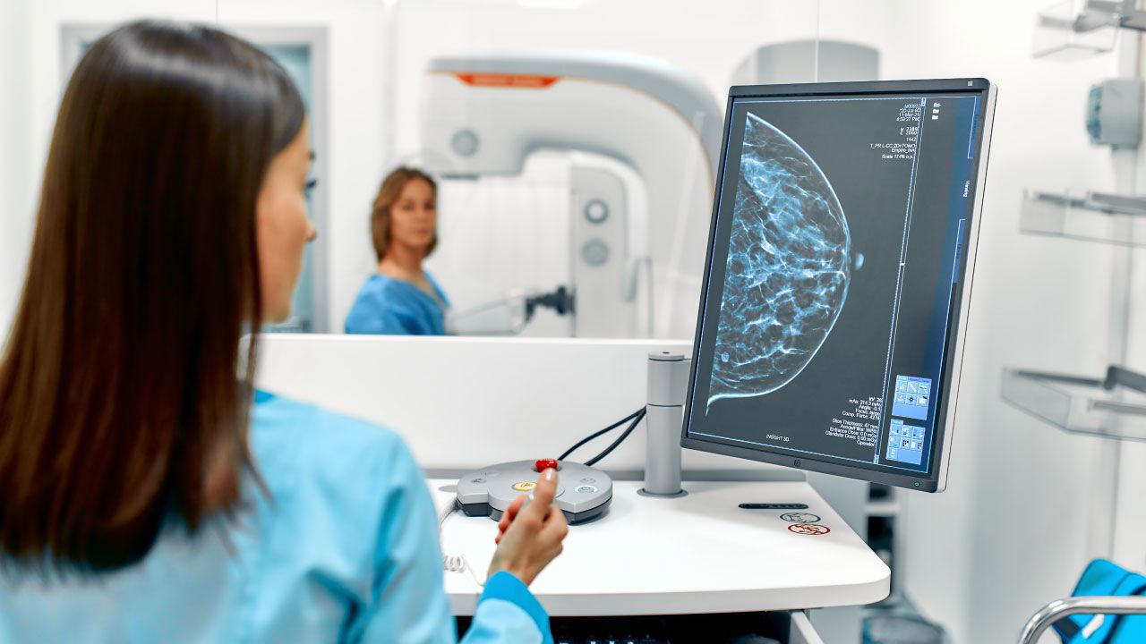 Woman undergoing mammogram screening