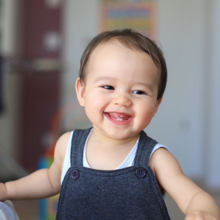 Child Smiling Showing Primary Teeth