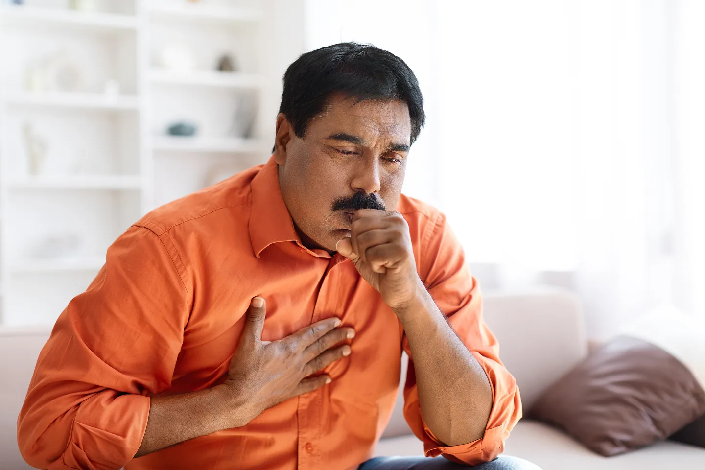 Simple Lung Icon With Highlighted Airways Narrowing Or Reacting To Dust/Pollen Particles.