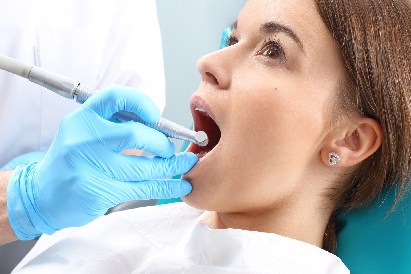 Tooth icon with a cape and shield representing root canal as a dental hero