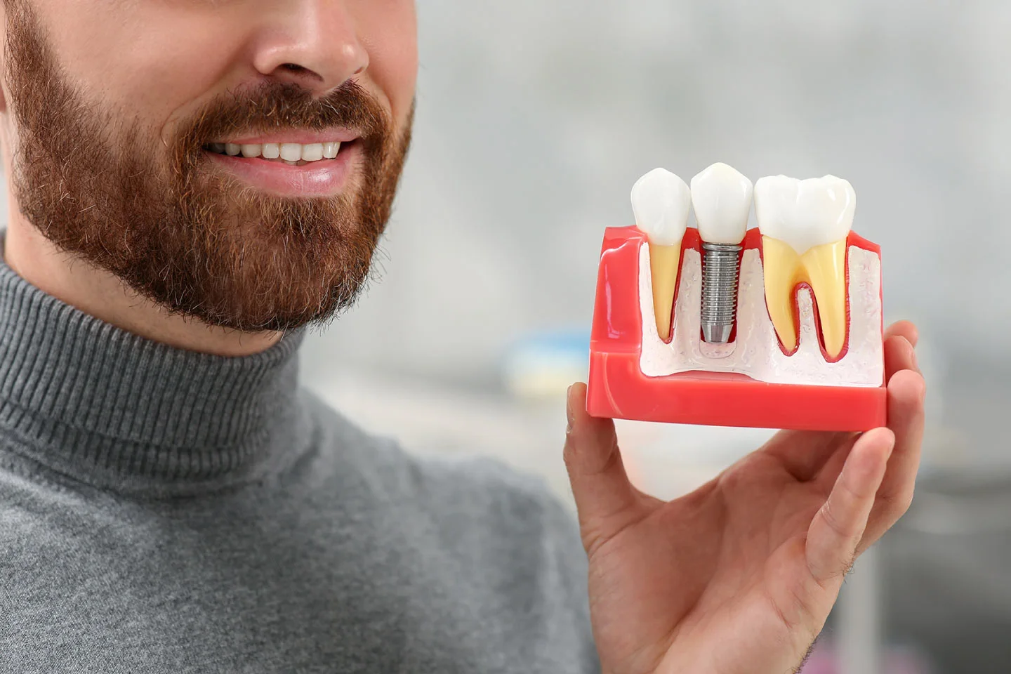 An Implant Dentist Discusses 5 Cosmetic Benefits of Replacing Missing Teeth