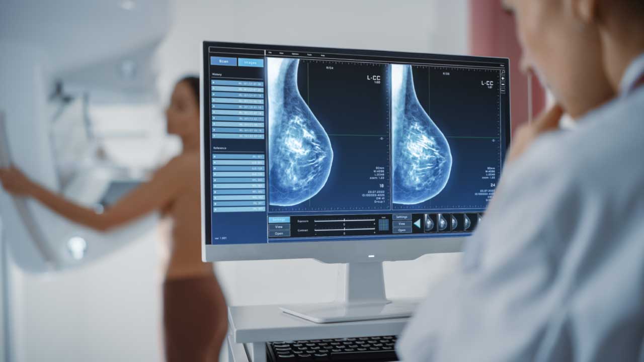 Illustration of a mammogram machine with a woman smiling confidently
