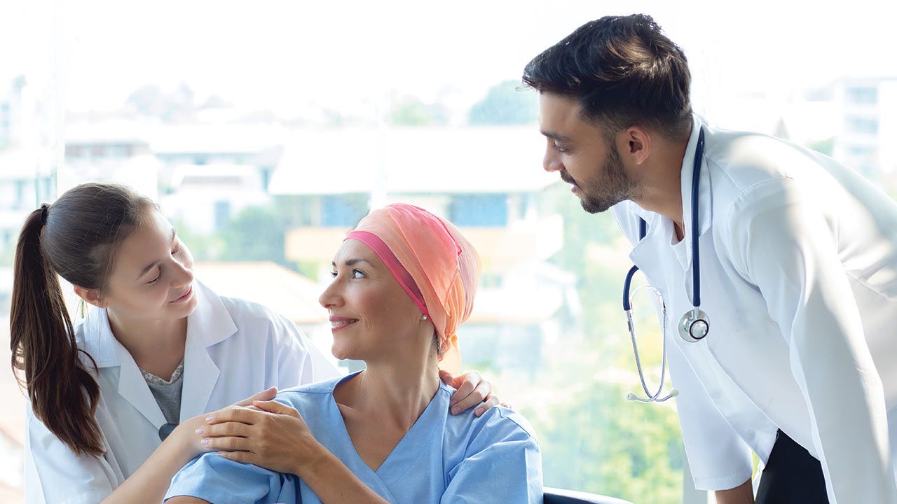 Doctor Explaining Cancer Warning Symptoms