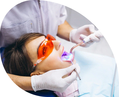 Dentist examining a patient during a routine dental checkup