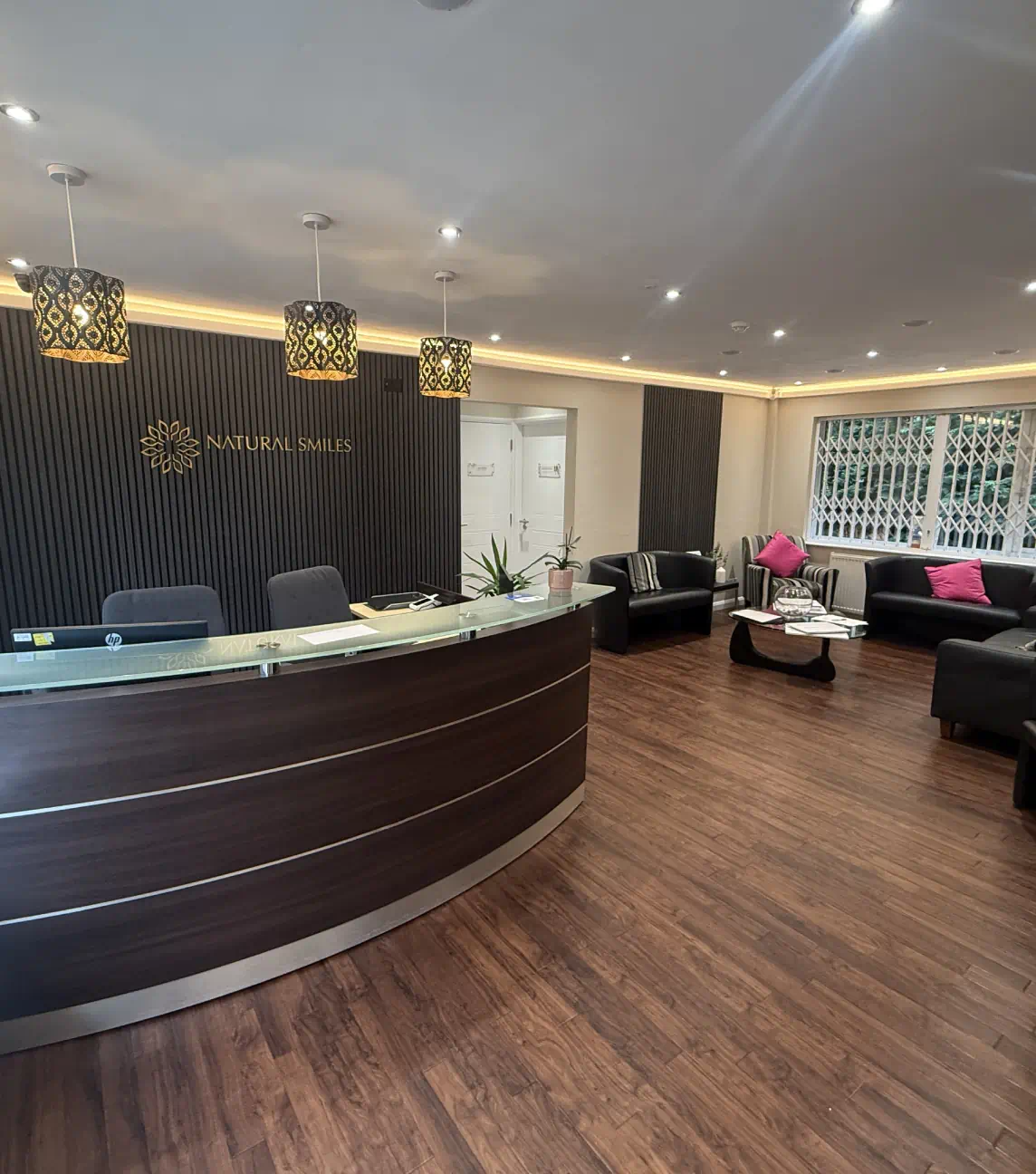 Natural Smiles dental office reception area with front desk and seating area