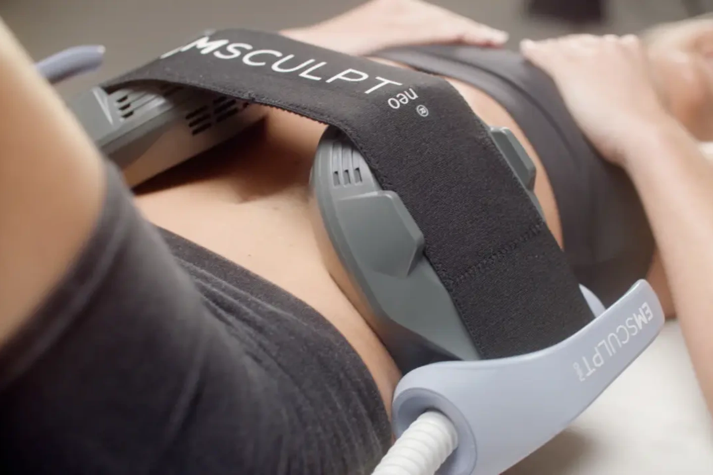 Emsculpt Neo body contouring treatment targeting abdominal fat and muscle toning